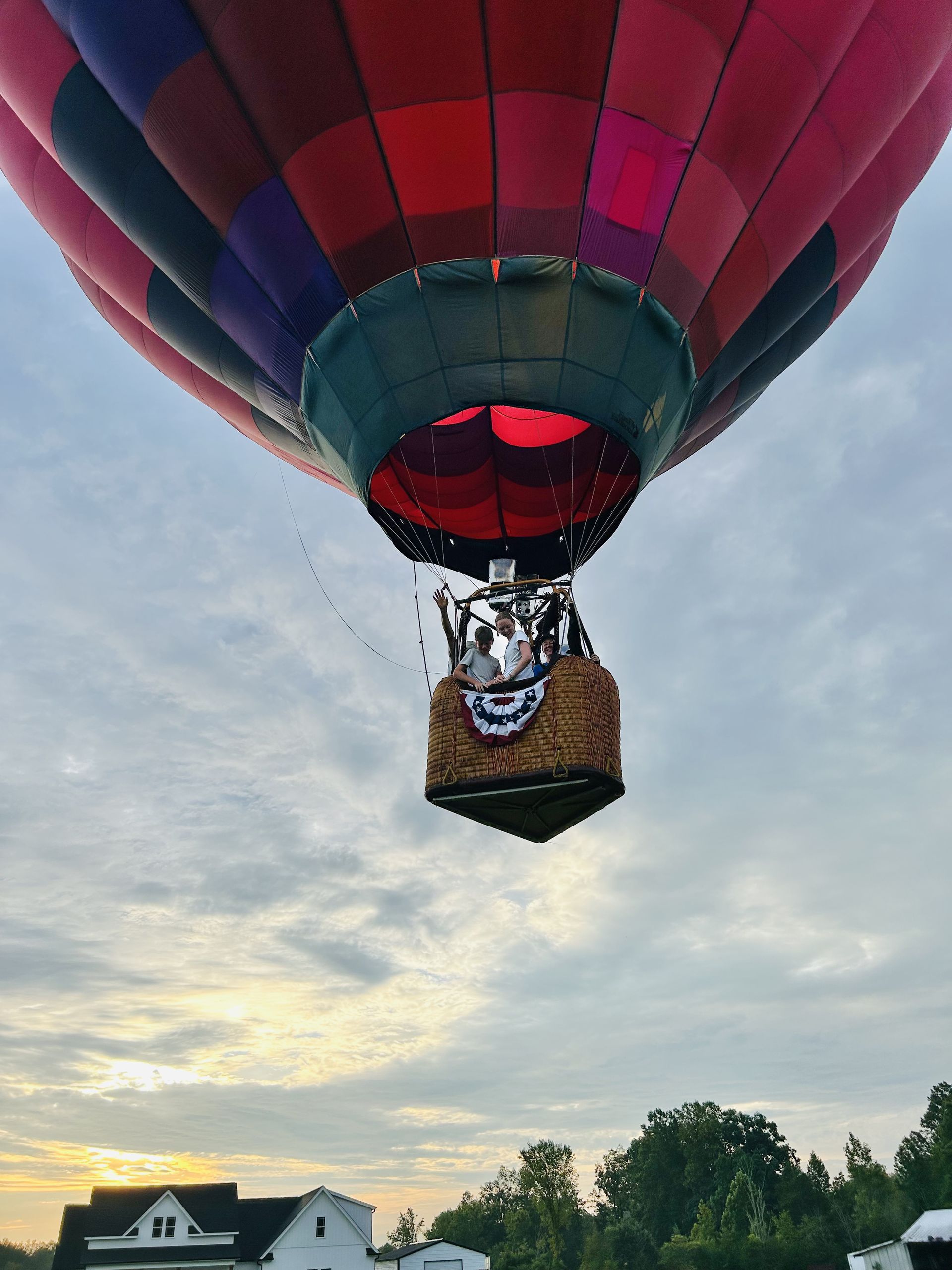 Balloon descending toward the basket with guests aboard