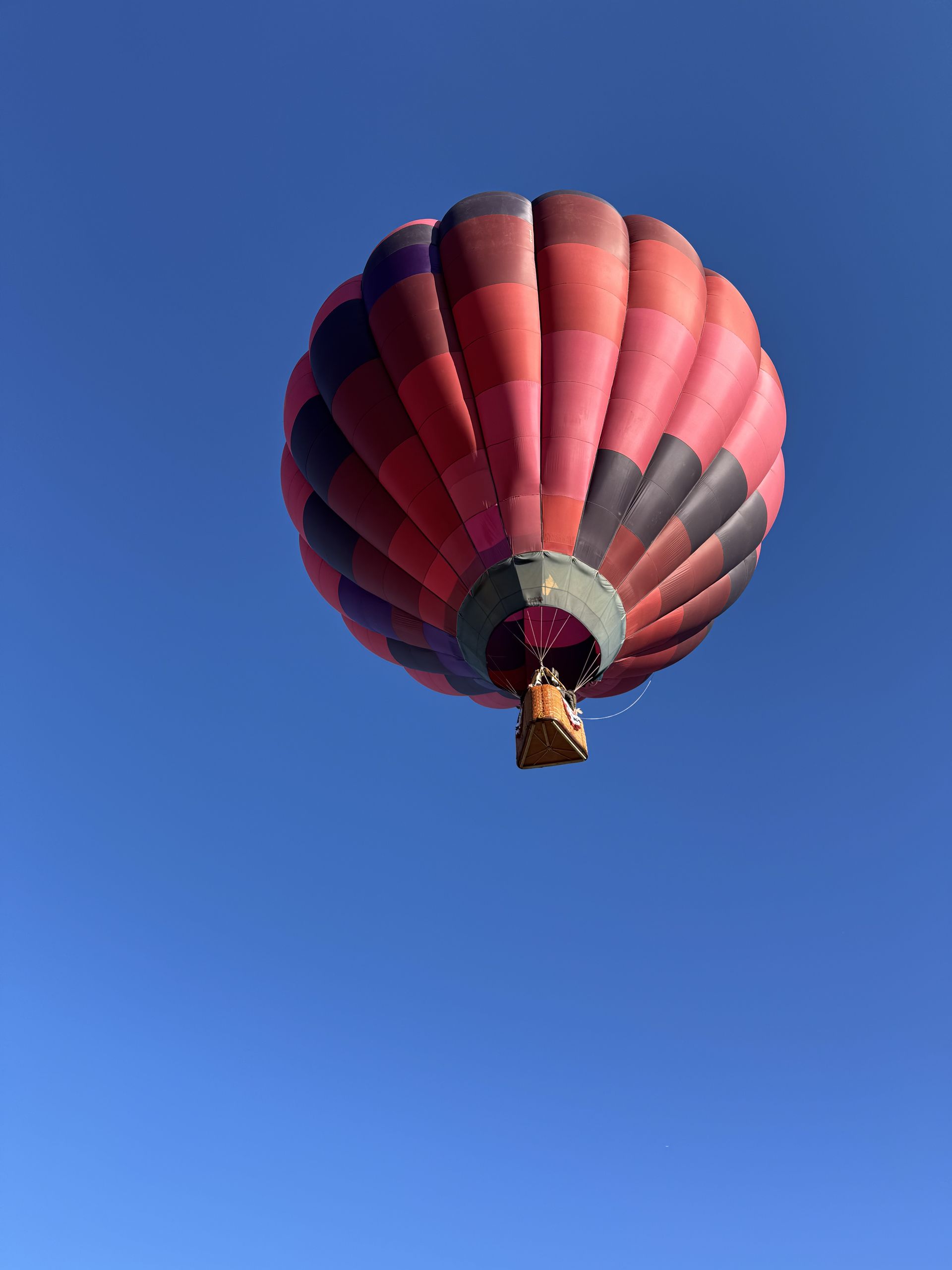 Balloon high in a clear blue sky